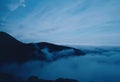 Clouds at dawn with low hanging fog over the Blue Ridge mountains Royalty Free Stock Photo