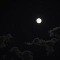 Clouds and moon floating in the night sky Royalty Free Stock Photo