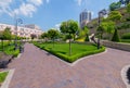 Clouds floating in the sky hitting the roof of a high-rise house beautiful view from a bench in the park Royalty Free Stock Photo