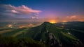 Clouds flow over the night landscape