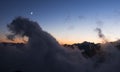 CLouds, fog. moon and mountain peaks at sunset, Monte Rosa, Alps