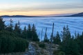 Clouds and fog over the coniferous forest in the mountains Royalty Free Stock Photo