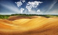 Clouds in the form of a map of the world over the field. Travel and landscape concept