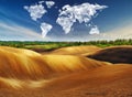 Clouds in the form of a map of the world over the field. Travel and landscape concept Royalty Free Stock Photo