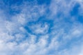 Clouds form a mosaic against the blue sky.