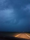 Clouds forming overhead driving down the highway in Saskatchewan