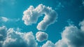 Clouds forming a question mark in a bright blue sky. Royalty Free Stock Photo