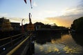 Clouds and golden sunset light reflection near a bamboo bridge in Serangan Island, Bali, Indonesia Royalty Free Stock Photo