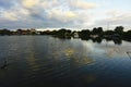 Clouds and golden sunset light reflection in Serangan Island seawater, Bali, Indonesia Royalty Free Stock Photo