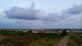 Clouds, grassland, saltpan, emptyness and a road