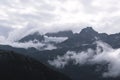 Clouds hanging over rugged mountains in Southern Alaska Royalty Free Stock Photo