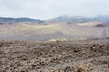 Clouds on hardened lava field on Mount Etna Royalty Free Stock Photo