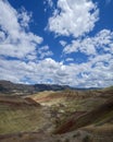 Clouds hover above Rainbow Hill at the Painted Hills Unit of the John Day Fossil Beds National Monument, Oregon, USA Royalty Free Stock Photo