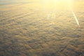 Clouds illuminated by the sun, flying above the clouds