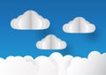 Clouds isolated on blue background in paper cut style. Royalty Free Stock Photo