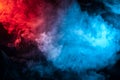 Clouds of isolated colored smoke: blue, red, orange, pink; scrolling on a black background