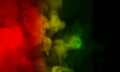 Abstract Clouds of isolated colored smoke:red, orange, green; scrolling on a black background in the dark. Abstract, flowing