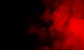 Abstract Clouds of isolated colored smoke:red scrolling on a black background in the dark. Abstract, flowing Royalty Free Stock Photo