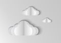Clouds isolated on blue background in paper cut style. Royalty Free Stock Photo