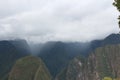 Clouds and mist descending on the Vilcabamba mountain range viewed from Machu Picchu, Royalty Free Stock Photo