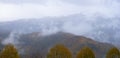 Clouds and mists over the forests and mountains of the sierra aralar in autumn, Navarra Royalty Free Stock Photo