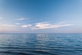 Clouds over blue sea waves. Sky reflecting in water. Ladoga lake Royalty Free Stock Photo