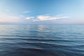 Clouds over blue sea waves. Sky reflecting in water. Ladoga lake Royalty Free Stock Photo