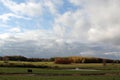 Clouds over farmland in fall