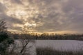 Clouds over a field in wintertime in Munsterland, Germany Royalty Free Stock Photo