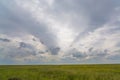 Clouds over green grass Royalty Free Stock Photo