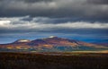 Clouds over the lake in the mountainous part of the tundra in autumn