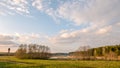 Clouds over the lake. Time before sunset Royalty Free Stock Photo