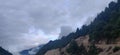 Clouds over looking mountains in our backyard