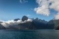 Clouds over Milford Sound, New Zealand. Royalty Free Stock Photo