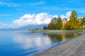 Clouds over mountain mirror reflection on the water sea in summer holiday