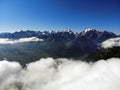 Clouds over mountain peaks. Fog in the Caucasus mountains. Royalty Free Stock Photo