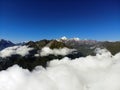 Clouds over mountain peaks. Fog in the Caucasus mountains. Royalty Free Stock Photo