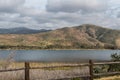 Clouds over a Mountain Range and Lake in Chula Vista, California Royalty Free Stock Photo