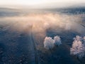 Clouds over the mountains and forest at foggy sunrise. Aerial view Royalty Free Stock Photo