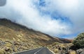 Clouds over the mountains near the Teide volcano on the island of Tenerife, motion, blurry, view from the car, track in the clouds Royalty Free Stock Photo