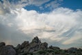 Clouds over rocks Royalty Free Stock Photo