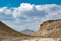 Clouds over rocks in a desert area Royalty Free Stock Photo
