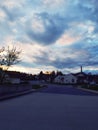 beautiful blue and pink clouds over a small town in the middle of  a circle road Royalty Free Stock Photo