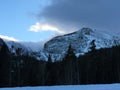 Clouds over snow capped mountain peaks. Royalty Free Stock Photo