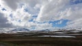 Clouds over snow capped mountains on Stekenjokk plateau in Sweden Royalty Free Stock Photo