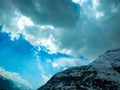 Clouds over the Snow covered mountains