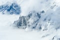 Clouds over snow mountains Royalty Free Stock Photo