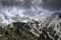 Clouds over snowy peaks. Royalty Free Stock Photo