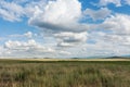 Clouds over steppe grass. Tyva. Steppe. Sunny summer day Royalty Free Stock Photo