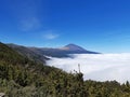 Clouds over the Teide National Park and volcano on the Island of Tenerife. Sea of clouds. Landscapes and extreme nature Royalty Free Stock Photo